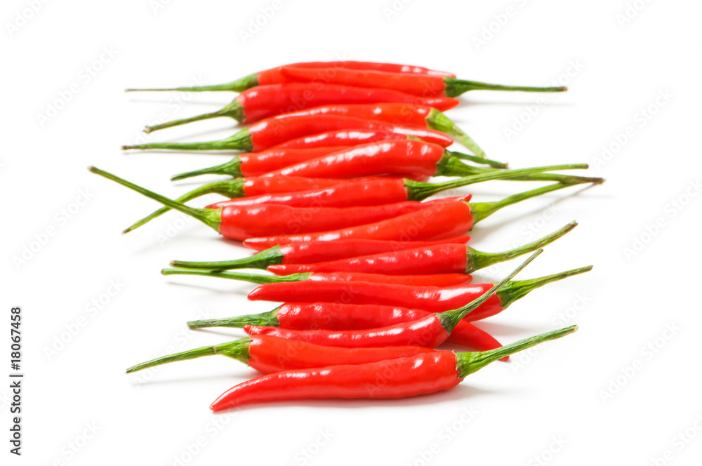 Red chili peppers isolated on the white Red chili peppers isolated on the white