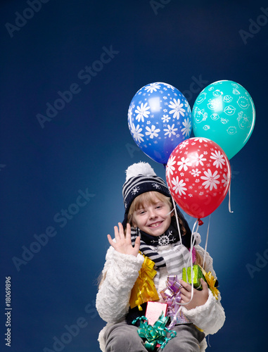 Happy Female Child posing over blue background