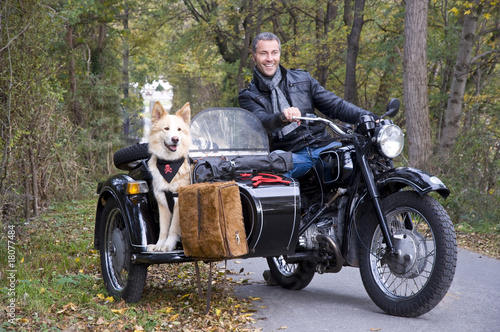 Happy man with motorcycle and Dog