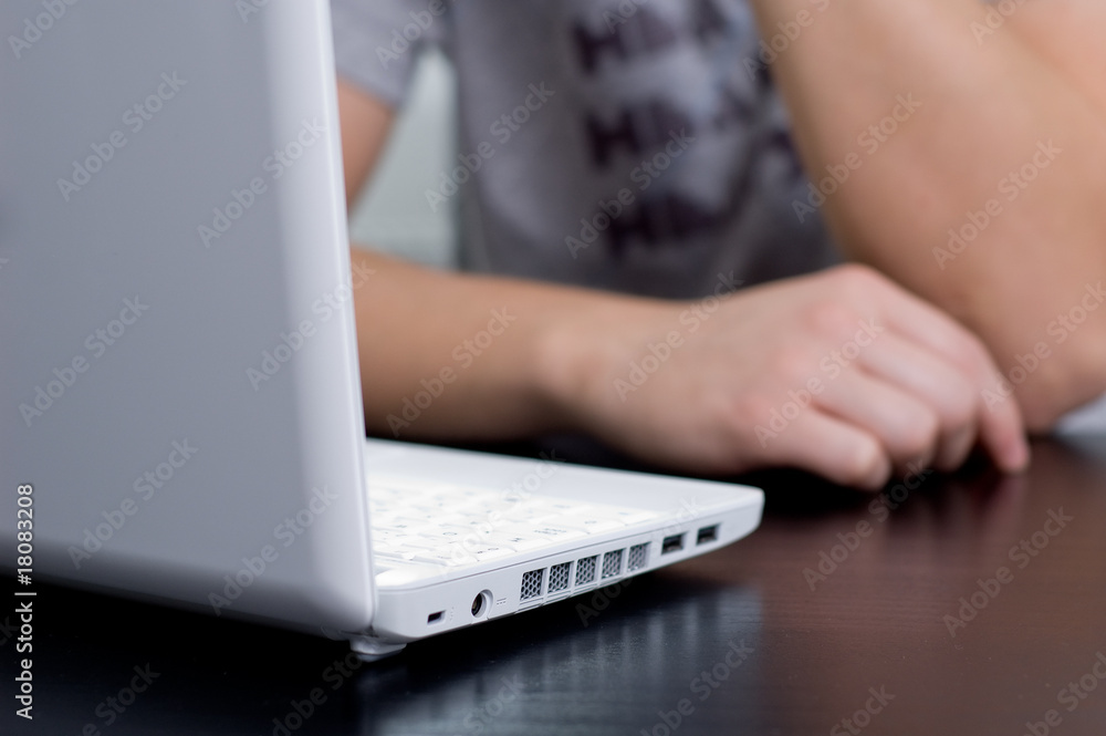 Fototapeta premium Man in casual clothing thinking in front of his netbook