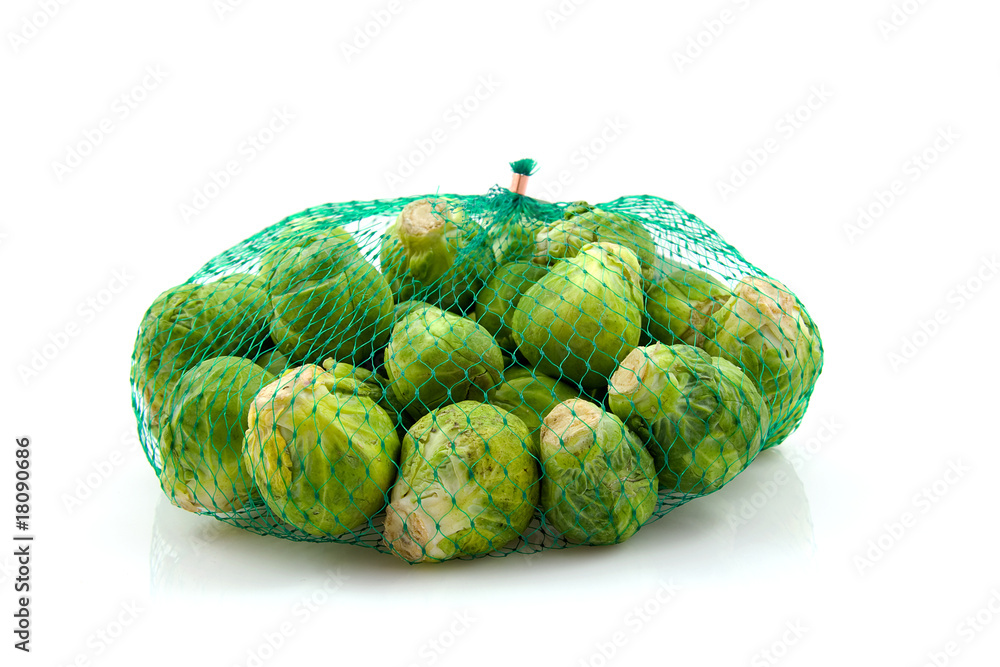Obraz premium Net Brussels sprouts over white background