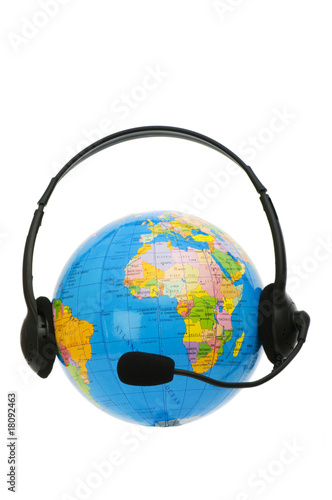 Headset on globe isolated on the white