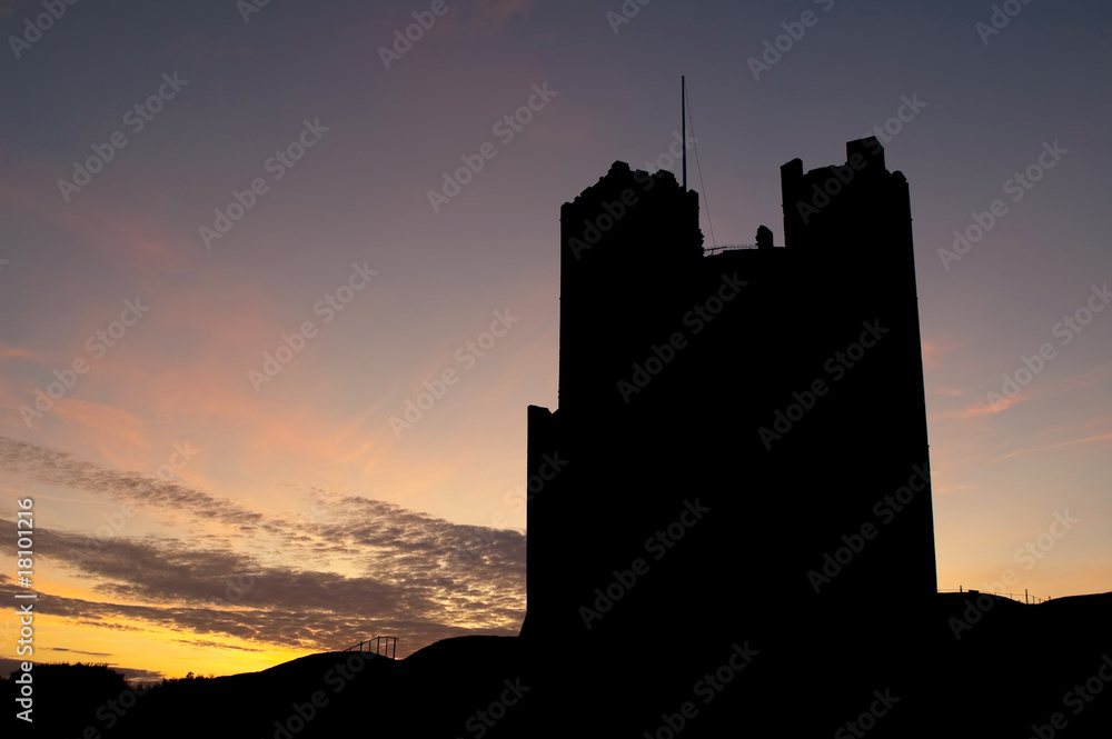 sunset silhouette of orford castle in the uk