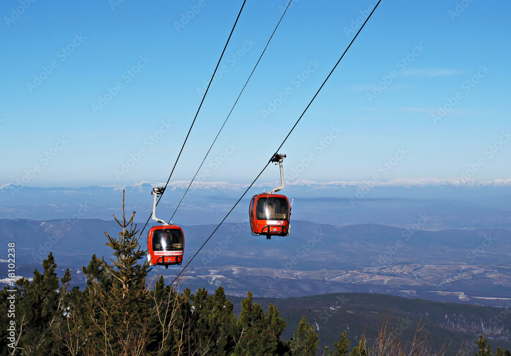 Cable car ski lift over mountain landscape Cable car ski lift over mountain landscape