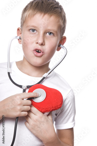 cute young boy playing doctor photo