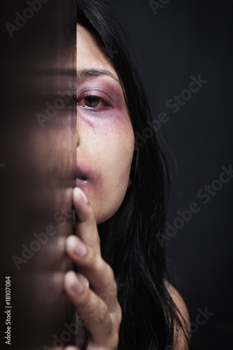 Injured woman hiding in dark