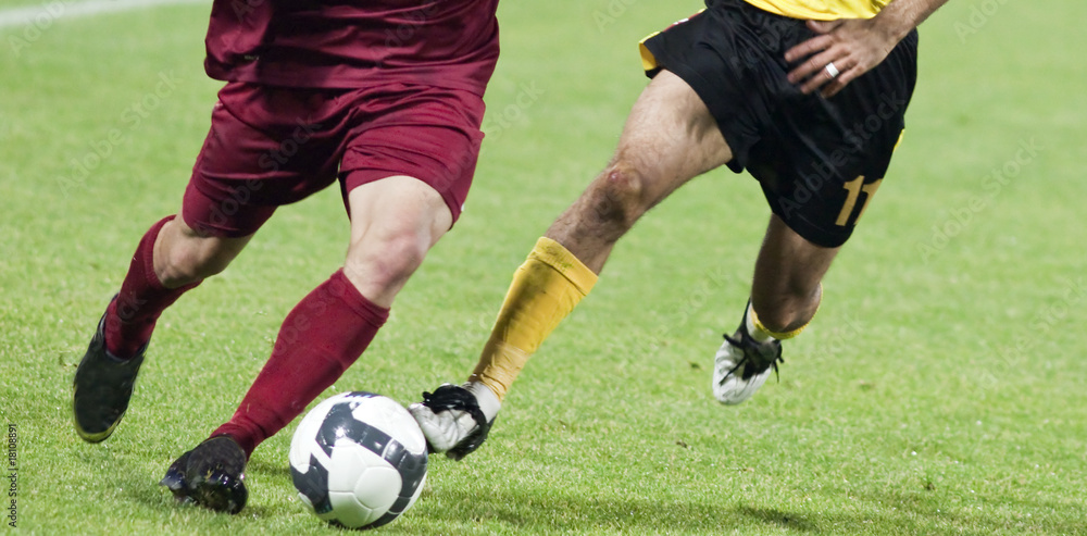 Soccer players fighting for the ball Soccer players fighting for the ball