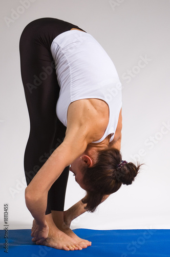 young yoga girl doing yogatic exericise photo