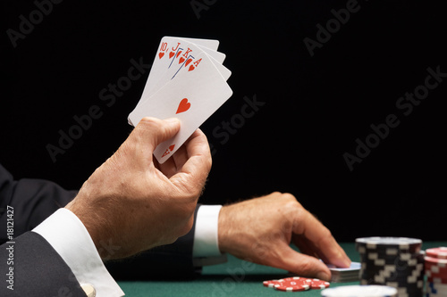 Poker player winning hand of cards royal flush