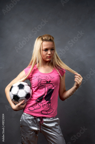 beautiful young blonde girl with soccer ball © fet