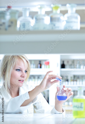 Fototapeta Naklejka Na Ścianę i Meble -  Closeup of a female researcher working in a lab