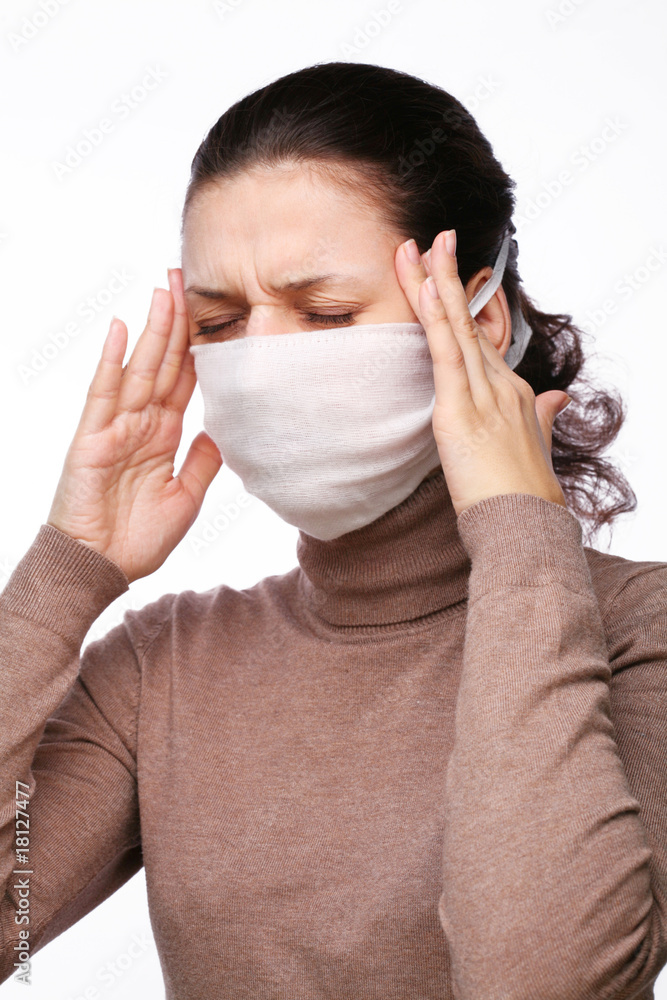 A girl has a headache, puts hands on temples A girl has a headache, puts hands on temples