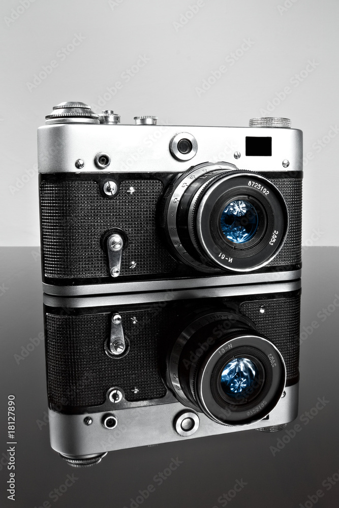 old camera on the glass with reflection old camera on the glass with reflection