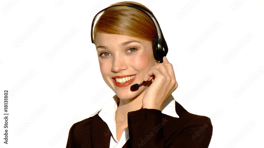 Beautiful young businesswoman is wearing headset Beautiful young businesswoman is wearing headset