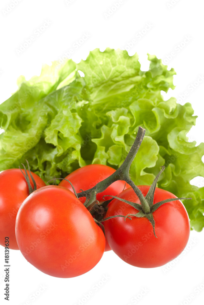 Ripe red tomatoes and green leaves of salad. Ripe red tomatoes and green leaves of salad.