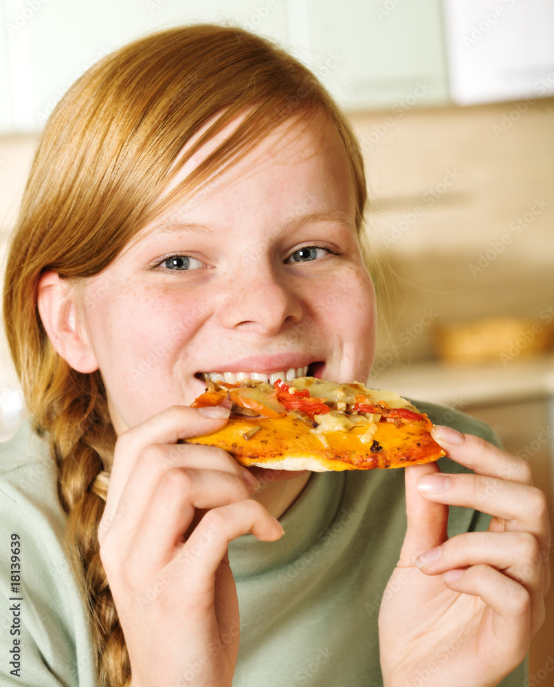 Teenage girl eating pizza Teenage girl eating pizza