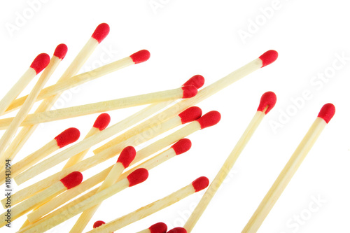 Set of red matches close up on white background