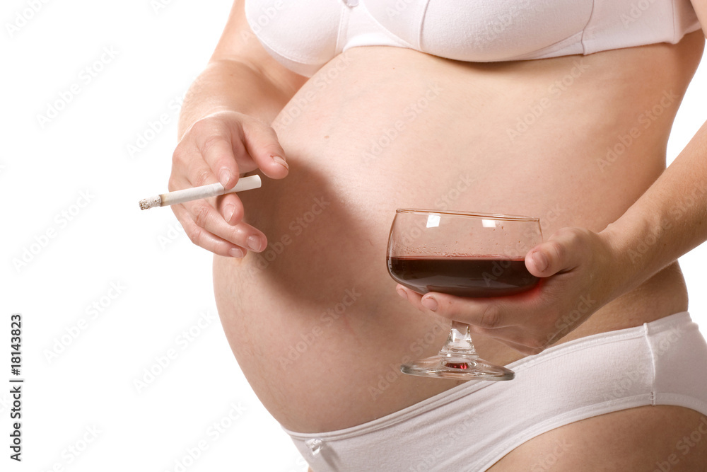 A close-up image of a pregnant woman holding a wine glass in one hand and a cigarette in the other, highlighting pregnancy health concerns.