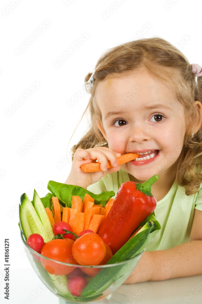 Little girl tasting and chomping a carrot Little girl tasting and chomping a carrot