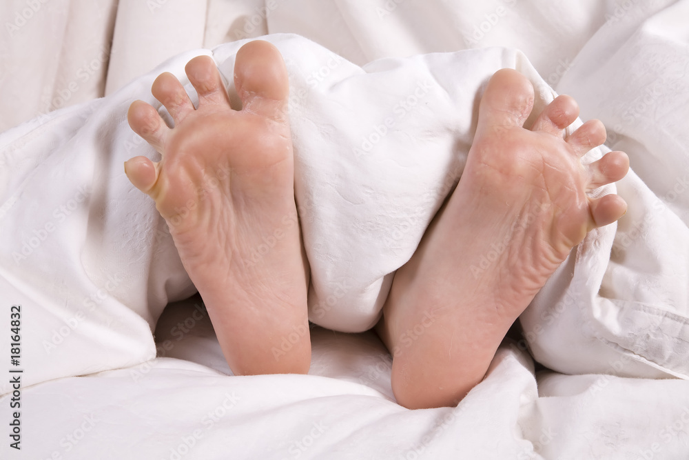 Childs feet in bed Childs feet in bed