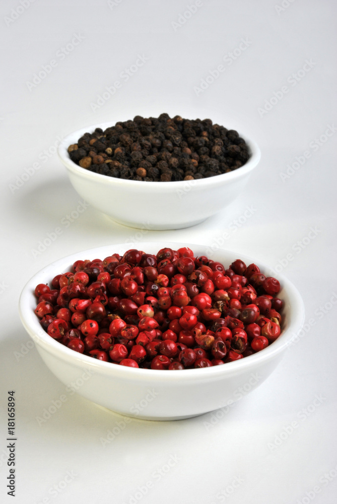 black and red pepper in a white bowl black and red pepper in a white bowl
