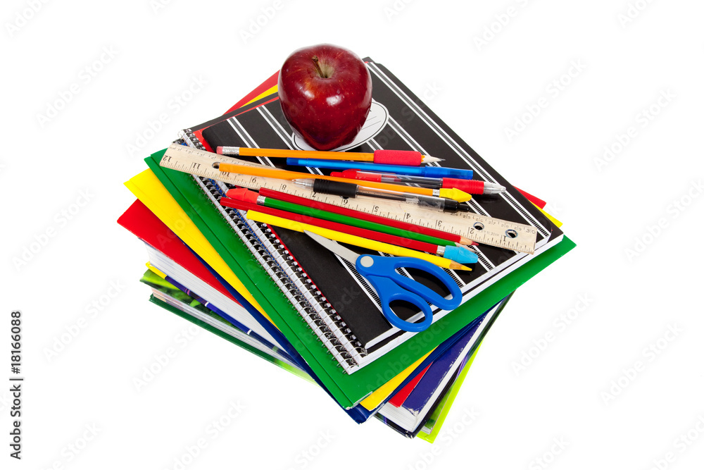 stack of textbooks with school supplies on top stack of textbooks with school supplies on top