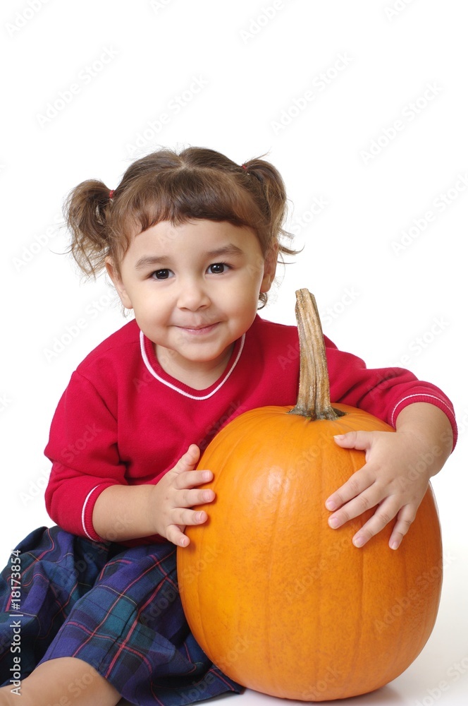 Fototapeta premium girl with a pumpkin, isolated on white
