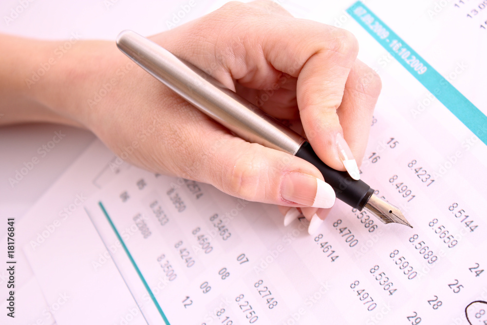 Pen in hand make some corrections in printed digits Pen in hand make some corrections in printed digits