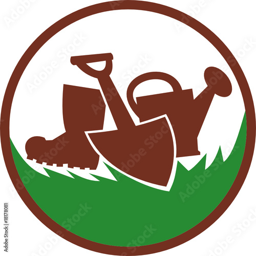 Spade shovel watering can and gumboot