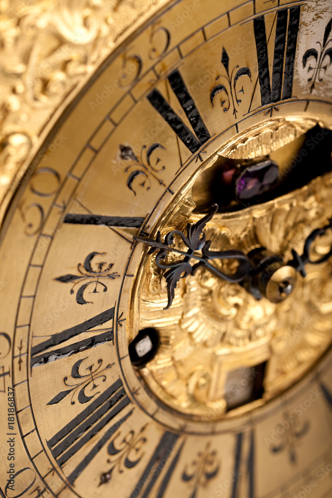 Close-up of historic gold and black clock
