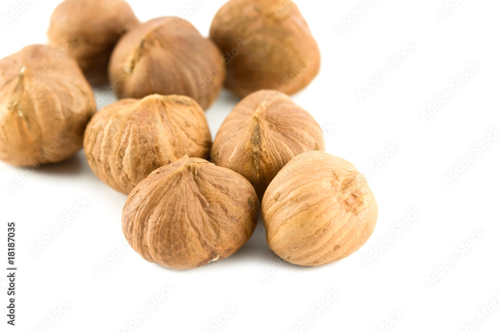 pile of hazelnuts isolated on white pile of hazelnuts isolated on white