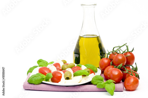 Fototapeta Naklejka Na Ścianę i Meble -  caprese - Italian salad with cherry tomatoes, olives and mozzare