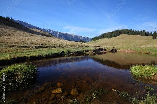 Autumn scenery in the mountains and lake reflection