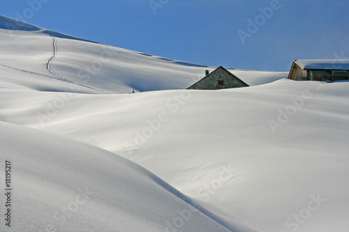 Winterlandschaft mit Almhütten