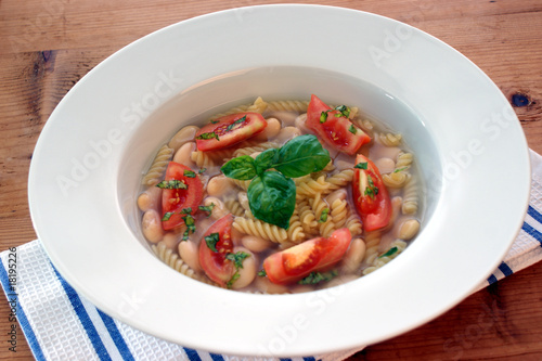 mediterranean noodle soup with white beans and tomato
