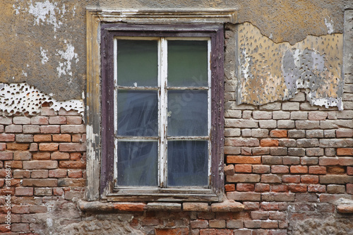 Old window with plaster and brick wall in Zagreb Croatia