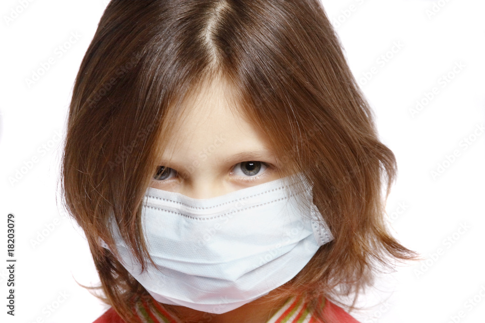 little girl wearing a protective mask