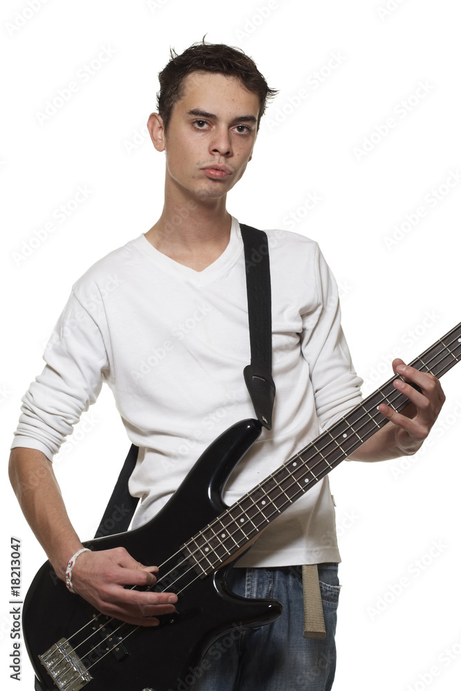The young guy with a bass guitar on a white background.