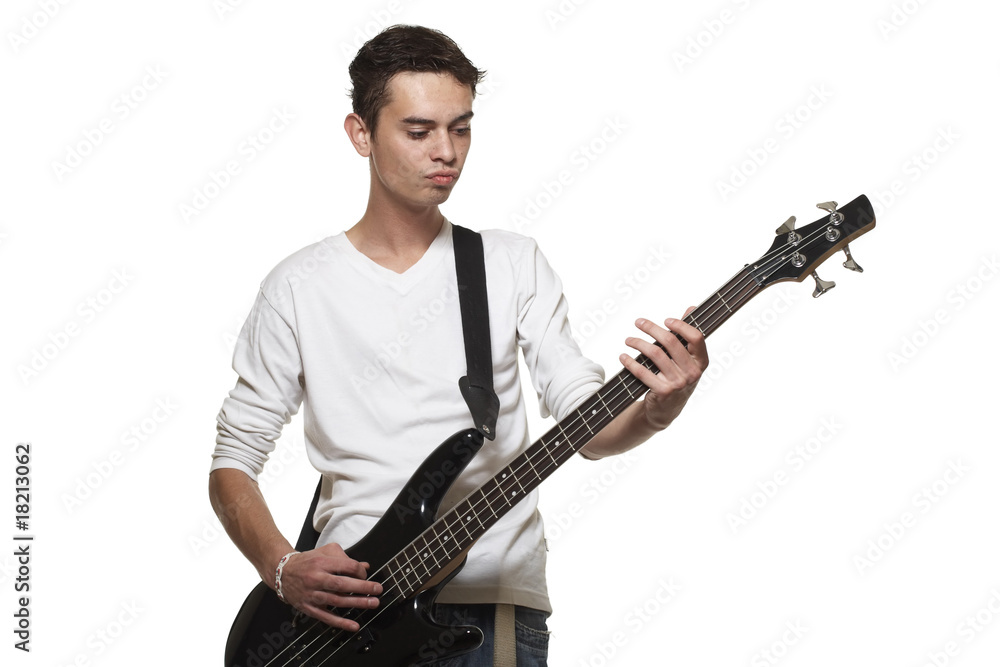 The young guy with a bass guitar on a white background. The young guy with a bass guitar on a white background.