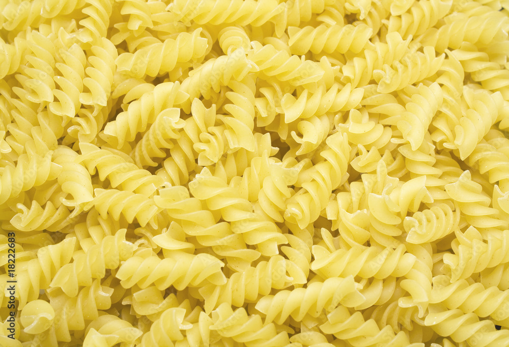 a background of Fusilli pasta from above a background of Fusilli pasta from above
