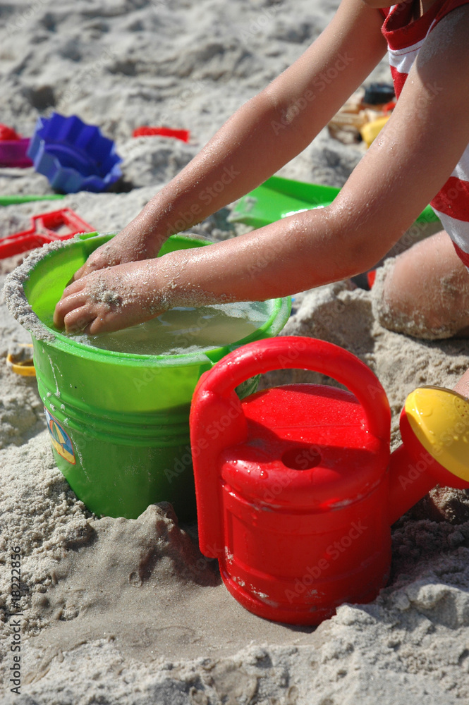 child playing with toys on the beach child playing with toys on the beach