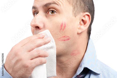 Man wiping lips traces from his face photo