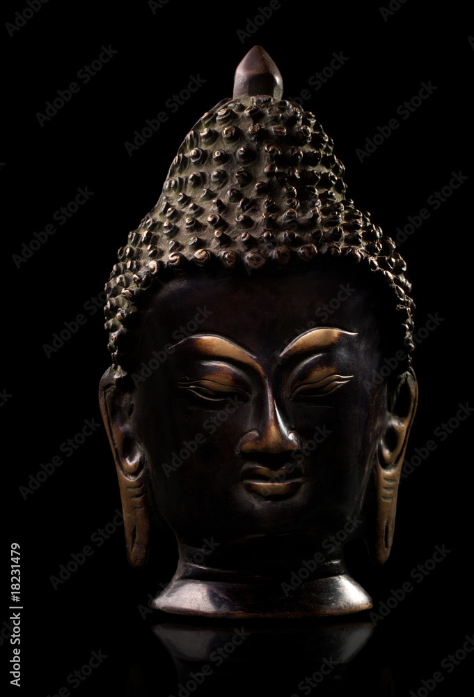 Buddha statue against black