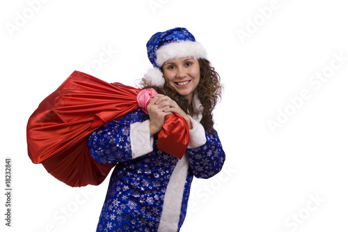 Santa woman is holding red sack with gifts.