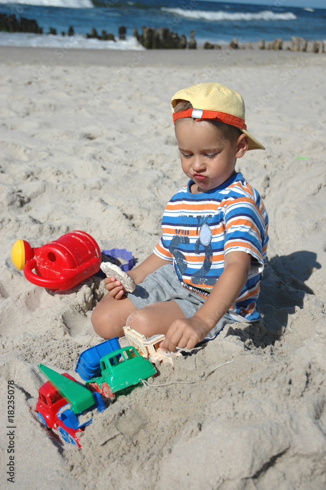child on the beach with cookie child on the beach with cookie
