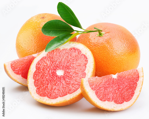 Grapefruits group with leaves on a white background.