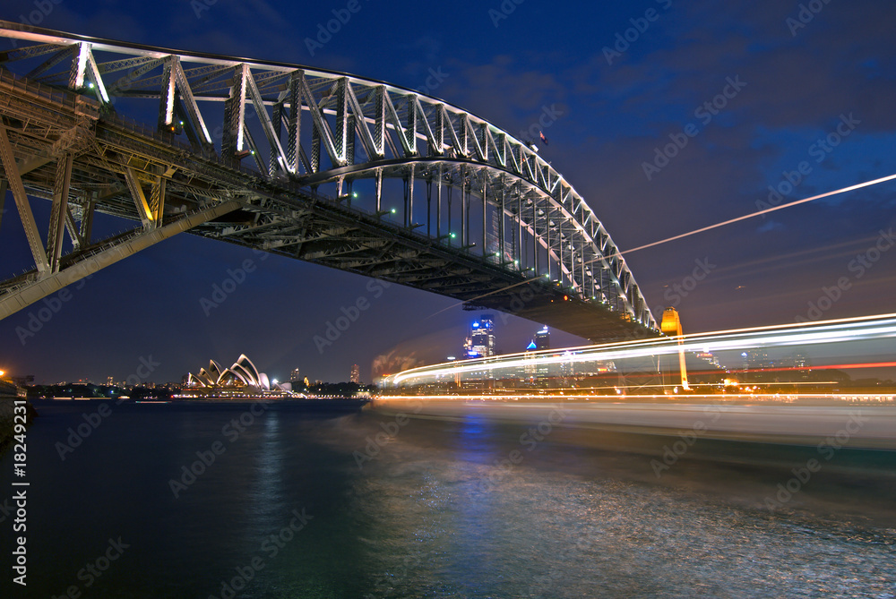 Sydney Harbor Bridge and streaks of light from a passing ferry