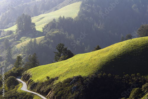 Winding country road and rolling green hills