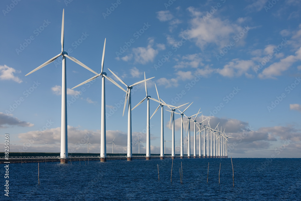 Enormous windmills standing in the sea