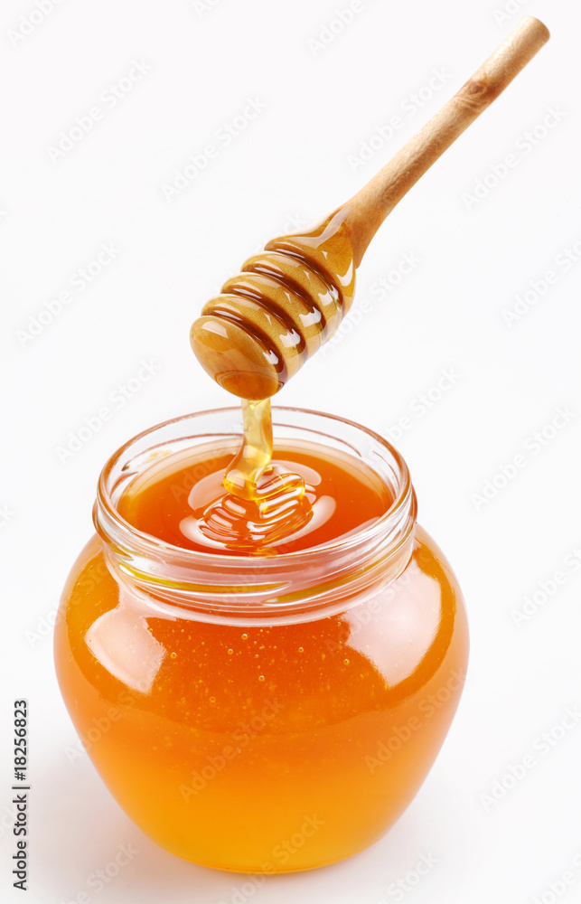 Full honey pot and honey stick Full honey pot and honey stick